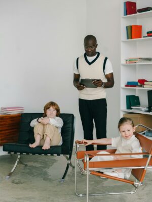 Psychologist standing between Two Children